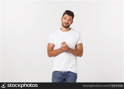 Well dressed man in the studio emphasize thoughtful thinking, think carefully and try to choose to hold hands and stand against the white background. Well dressed man in the studio emphasize thoughtful thinking, think carefully and try to choose to hold hands and stand against the white background.