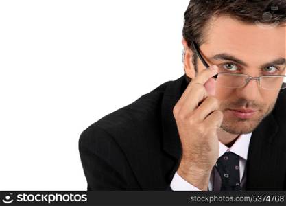 Well dressed man touching glasses