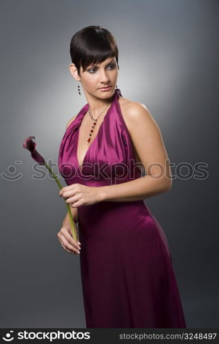 Well-dressed young lady in dressed for ball.