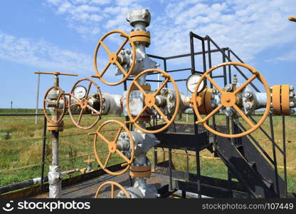 Well for oil and gas production. Oil well wellhead equipment. Oil production. Wells in the Kuban. Extraction of hydrocarbons.. Wells in the Kuban. Extraction of hydrocarbons. Well for oil and gas production. Oil well wellhead equipment. Oil production.