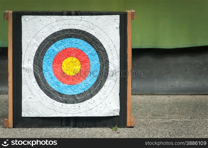 well used empty archery target with copy-space
