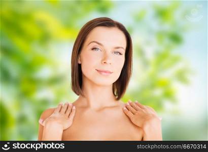 wellness and beauty concept - portrait of beautiful bare woman over green natural background. beautiful bare woman over green natural background. beautiful bare woman over green natural background