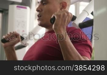 Wellness and training in fitness club, hispanic man exercising in gym. Sequence