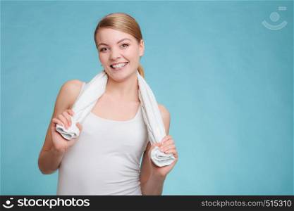 Wellness health care and clean body. Young woman happy after shower. Hold towel on shoulders smiling.. Smiling woman in white top hold towel.
