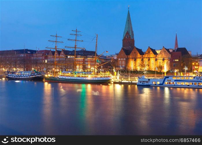 Weser River and St Martin Church, Bremen, Germany. Night view of the Weser River and Protestant Lutheran Saint Martin Church in the old town of Bremen, Germany.