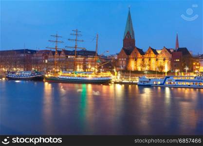 Weser River and St Martin Church, Bremen, Germany. Night view of the Weser River and Protestant Lutheran Saint Martin Church in the old town of Bremen, Germany.