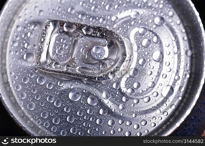 wet aluminium can with drink, close-up of top