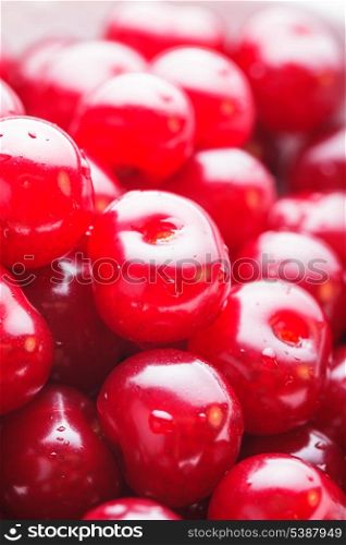 Wet cherries fruits close up as a background