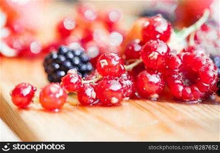 Wet currant on a wooden table