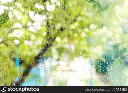 wet home window with raindrops after summer rain