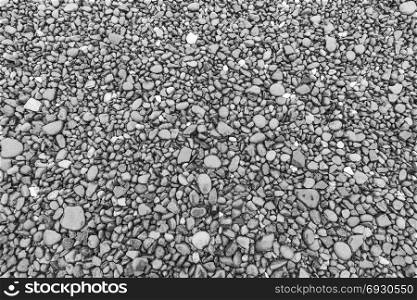 Wet pebble, rocks background. Stone texture. Wet pebble, rocks background