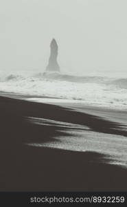 Wet sand beach monochrome landscape photo. Beautiful nature scenery photography with cliff on background. Idyllic scene. High quality picture for wallpaper, travel blog, magazine, article. Wet sand beach monochrome landscape photo