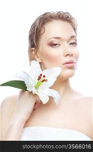 wet woman in white towel with white flower on white background