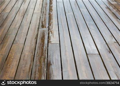 Wet wooden planks. Wet wooden planks background pattern on a rainy day