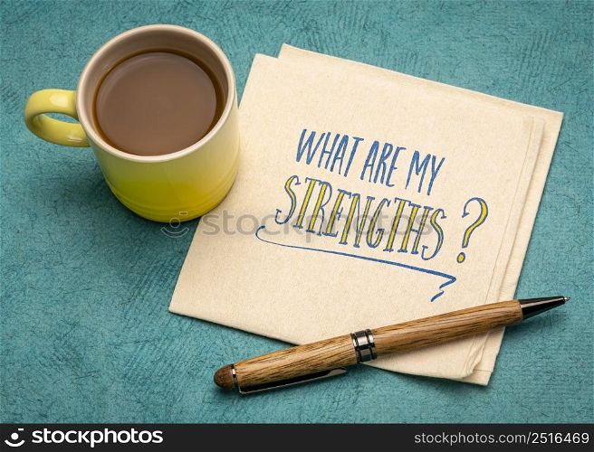 what are my strengths question - handwriting on a napkin with a cup of coffee, personal development concept