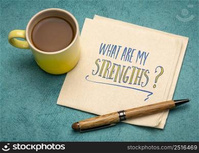 what are my strengths question - handwriting on a napkin with a cup of coffee, personal development concept