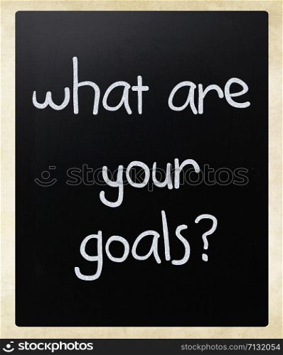""What are your goals?" handwritten with white chalk on a blackboard"