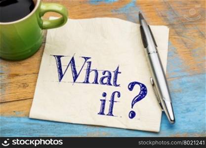 What if question - handwriting on napkin with a cup coffee against grunge painted wood