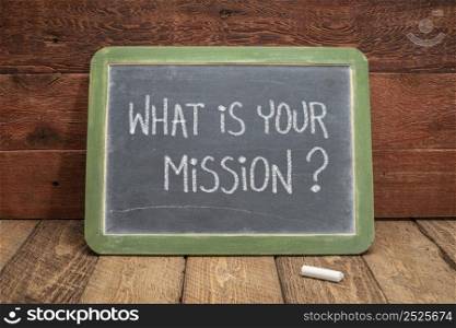 what is your mission question - white chalk handwriting on a slate blackboard, leadership and business concept