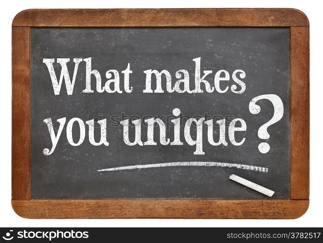 What makes you unique question on a vintage blackboard isolated on white