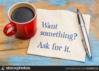 What something? Ask for it. - handwriting on a napkin with a cup of coffee