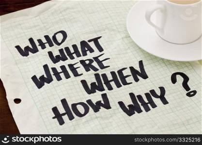 what, when, where, why, how, who questions - black marker handwriting on a grid paper with a coffee cup