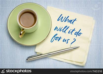 What will it do for us? Handwriting on a napkin with a cup of coffee.