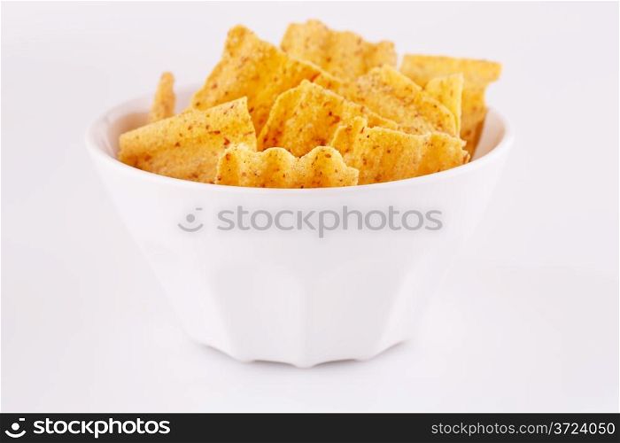 Wheat chips in bowl isolated on gray background.