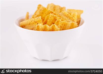 Wheat chips in bowl isolated on gray background.