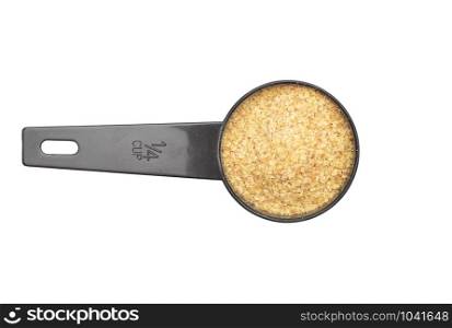 Wheat germs in measuring spoon on white background