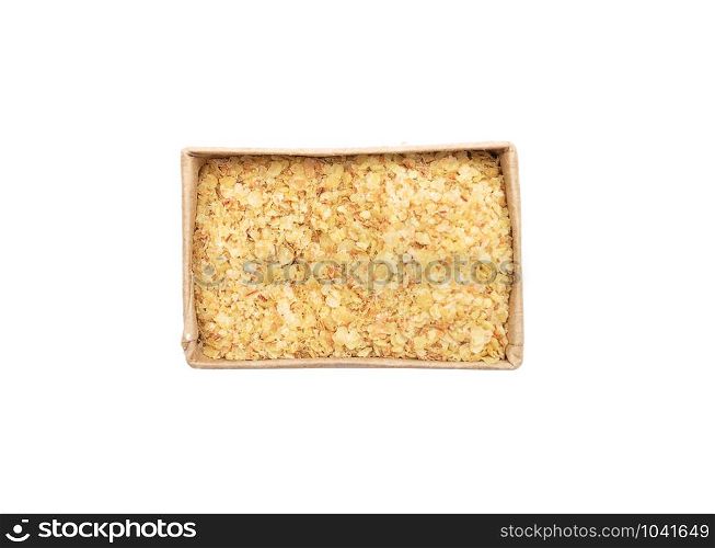 Wheat germs in paper box on white background