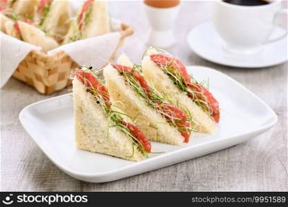 Wheat toast sandwich with cream cheese with microgreen alfalfa sprouts and salami. Healthy and fresh food.