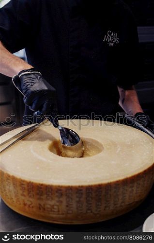 wheel of a large Parmesan cheese used to prepare the pasta sauce