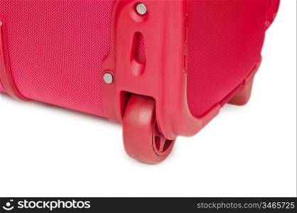 wheel on a pink suitcase isolated on the white background