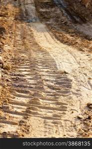 wheel track and foot print on clay road
