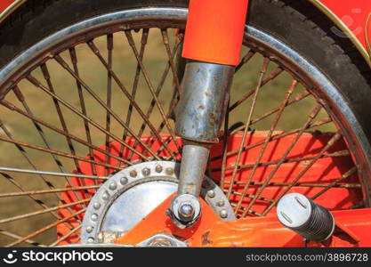 Wheels of motorcycles with tire l close up on the road.