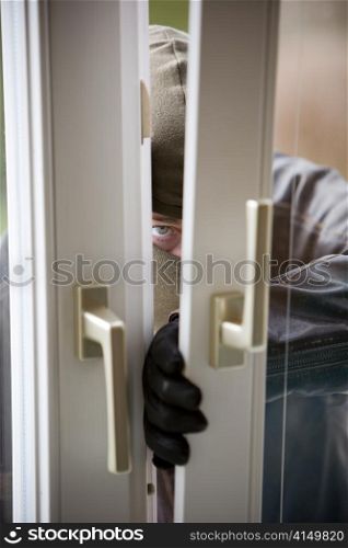 when a burglar break the window of a house