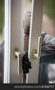 when a burglar break the window of a house