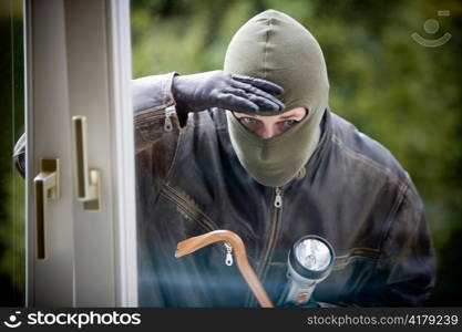 when a burglar break the window of a house