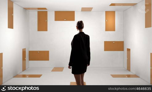 When making difficult decision. Businesswoman in room choosing one of plenty of doors