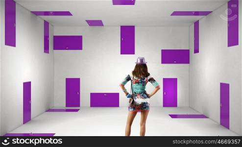 When making difficult decision. Woman wearing colorful dress in room choosing one of plenty of doors