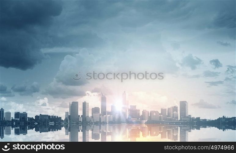 When new day starts. Panoramic modern city view in lights of sunrise
