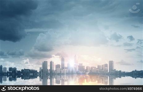 When new day starts. Panoramic modern city view in lights of sunrise