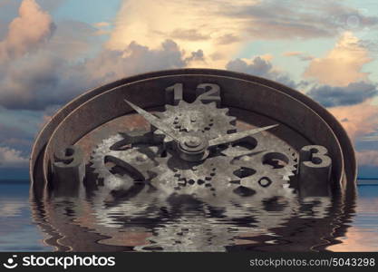 When time is passing. Time concept with clock mechanism drowning in water