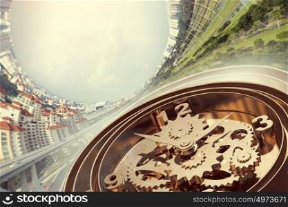When time is passing. Time concept with old clock mechanism against sky background