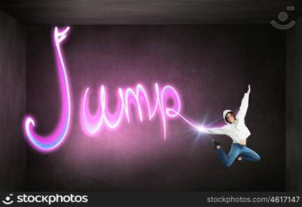 When you young and happy. Young girl jumping high in sky and drawing dance concept