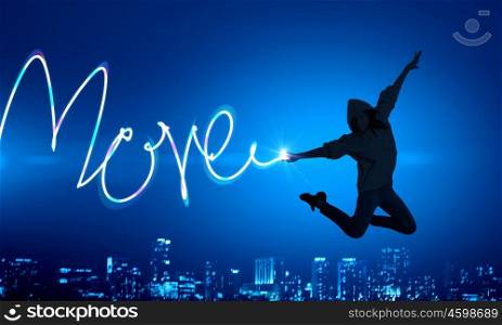 When you young and happy. Young girl jumping high in sky and drawing love word
