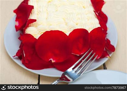 whipped cream mango cake with red rose petals