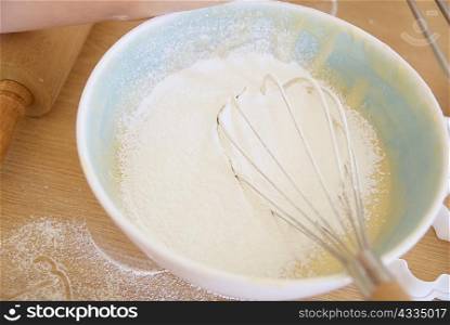 Whisk in bowl of batter in kitchen