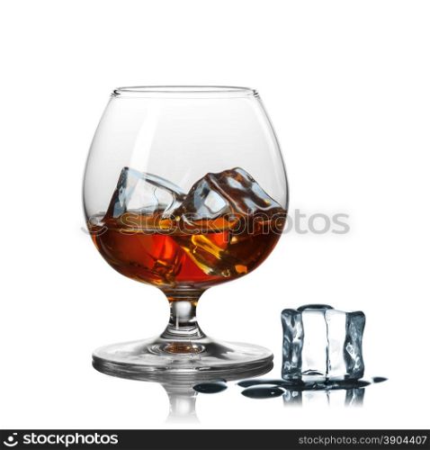 whiskey with ice in glass isolated on white background. whiskey with ice in glass isolated on white